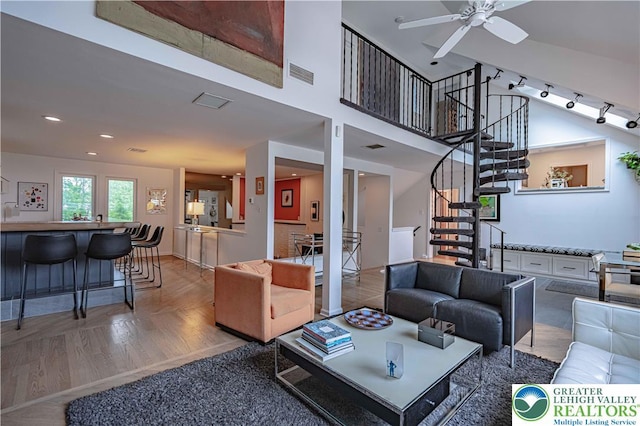 306 W Paxinosa Rd, Forks Twp, PA 18040 - living room featuring a ceiling fan, stairs, and a towering ceiling