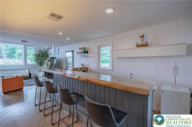 306 W Paxinosa Rd, Forks Twp, PA 18040 - kitchen featuring light wood finished floors, recessed lighting, a breakfast bar area, and open floor plan