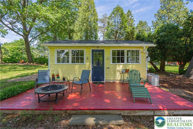 306 W Paxinosa Rd, Forks Twp, PA 18040 - wooden terrace with a fire pit and central AC unit