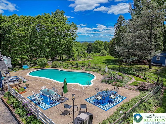 306 W Paxinosa Rd, Forks Twp, PA 18040 - community pool featuring a patio and view of scattered trees