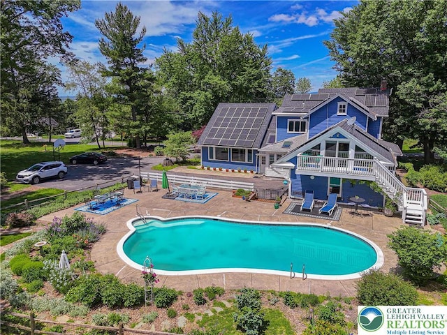 306 W Paxinosa Rd, Forks Twp, PA 18040 - swimming pool featuring a patio, a deck, and stairway