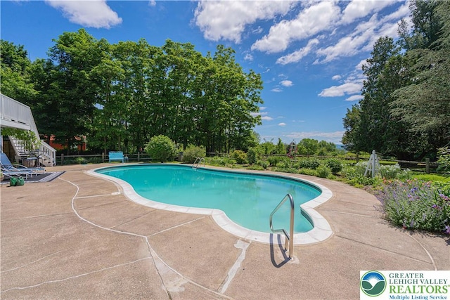 306 W Paxinosa Rd, Forks Twp, PA 18040 - view of swimming pool featuring a patio area and view of scattered trees