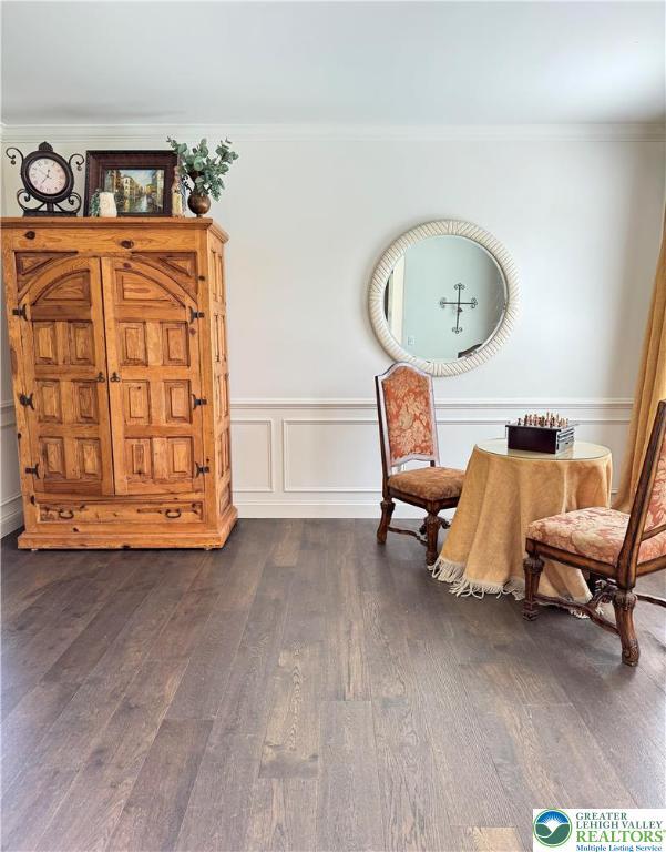 3183 Sheffield Dr, Lower Macungie Twp, PA 18049 - sitting room with dark wood-style floors and ornamental molding