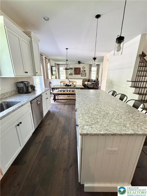 3183 Sheffield Dr, Lower Macungie Twp, PA 18049 - kitchen with dishwasher, plenty of natural light, and white cabinets