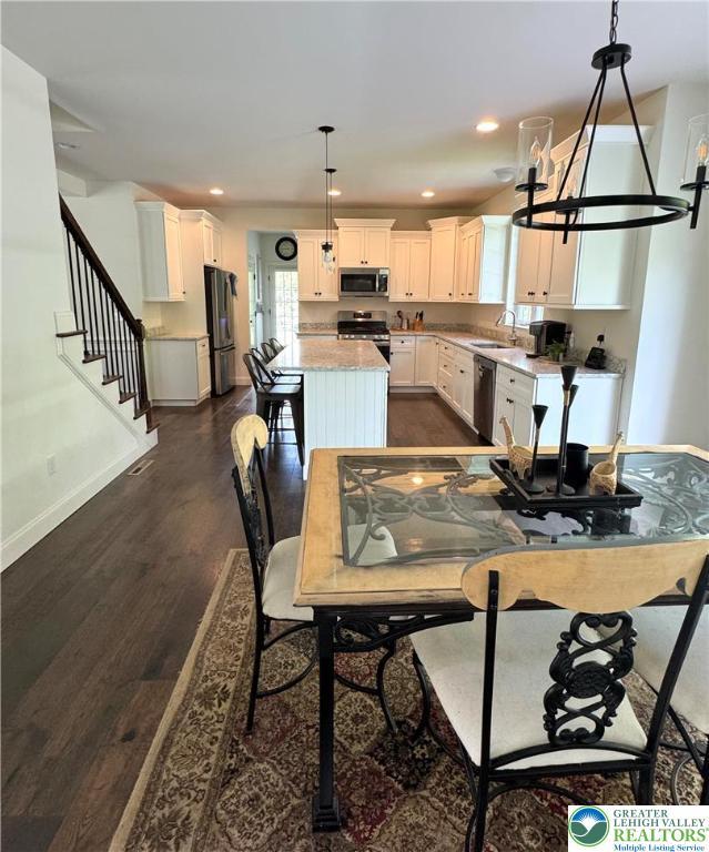 3183 Sheffield Dr, Lower Macungie Twp, PA 18049 - dining space featuring dark wood-style flooring, baseboards, stairs, and recessed lighting