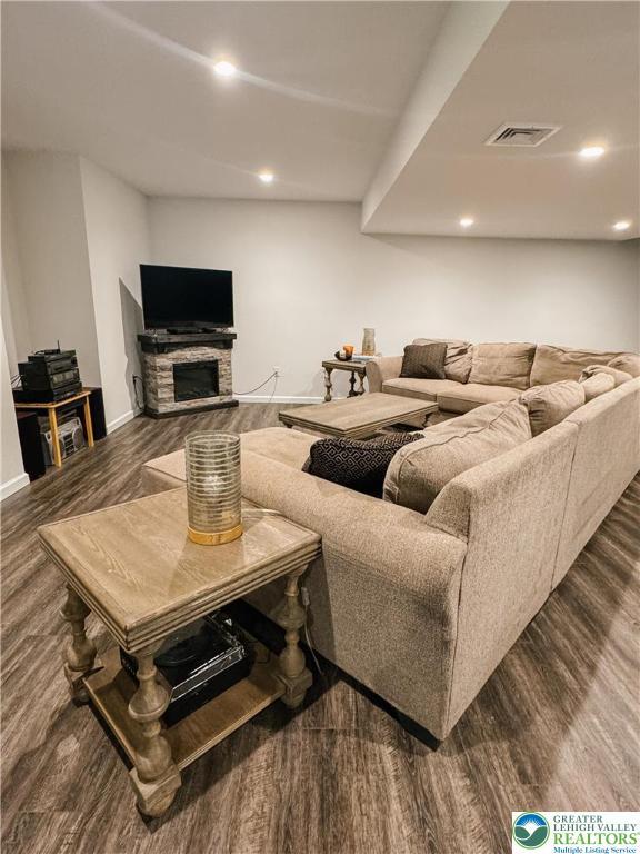 3183 Sheffield Dr, Lower Macungie Twp, PA 18049 - living area featuring dark wood-style floors, recessed lighting, baseboards, and a fireplace