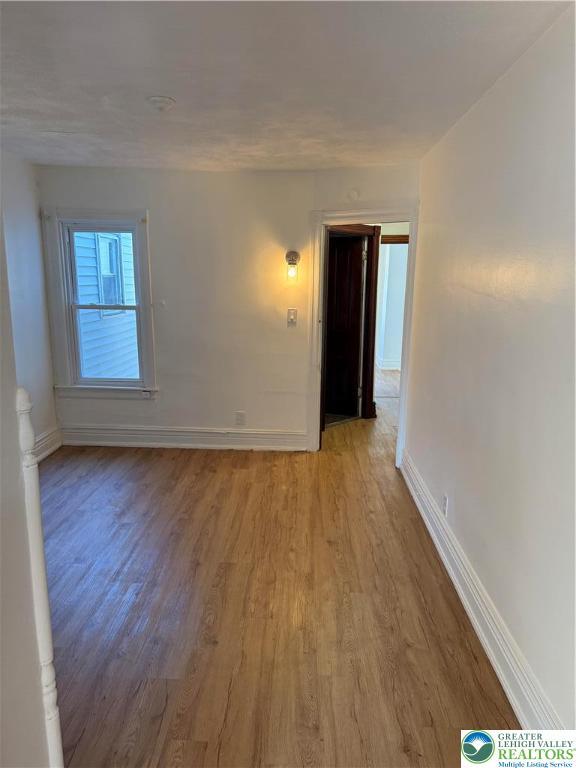 617 N 9th St, Allentown City, PA 18102 - empty room featuring light wood finished floors and baseboards