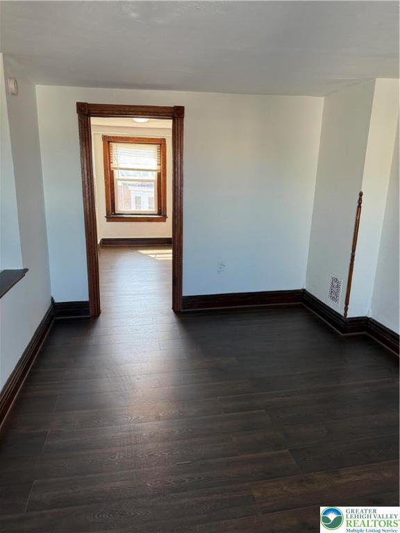 617 N 9th St, Allentown City, PA 18102 - spare room with baseboards and dark wood-style flooring