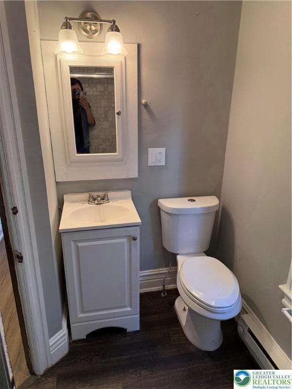 617 N 9th St, Allentown City, PA 18102 - bathroom with vanity, toilet, baseboards, and wood finished floors