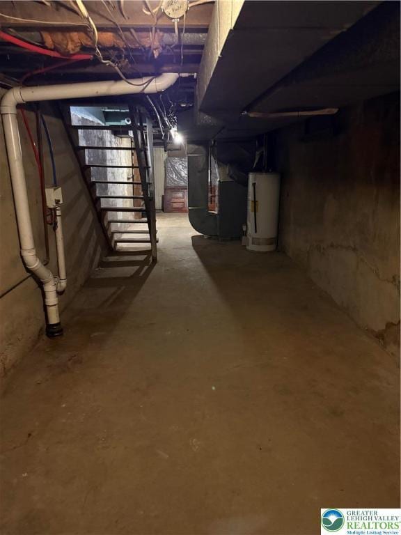 617 N 9th St, Allentown City, PA 18102 - unfinished basement with water heater, heating unit, and stairs