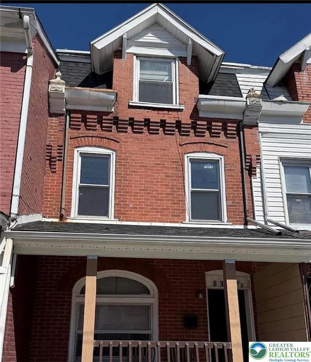 617 N 9th St, Allentown City, PA 18102 - view of side of home with brick siding and a porch