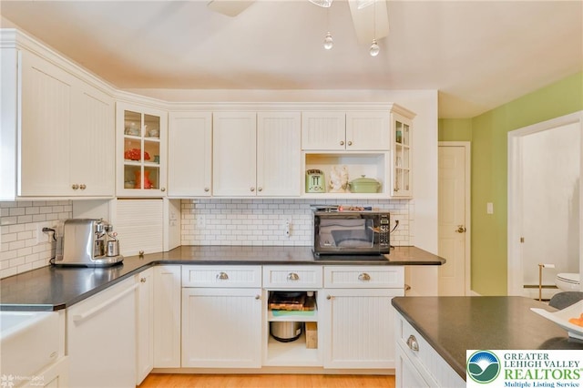 113 S Fairview St, Macungie Borough, PA 18062 - kitchen with black microwave, dark countertops, backsplash, and glass insert cabinets
