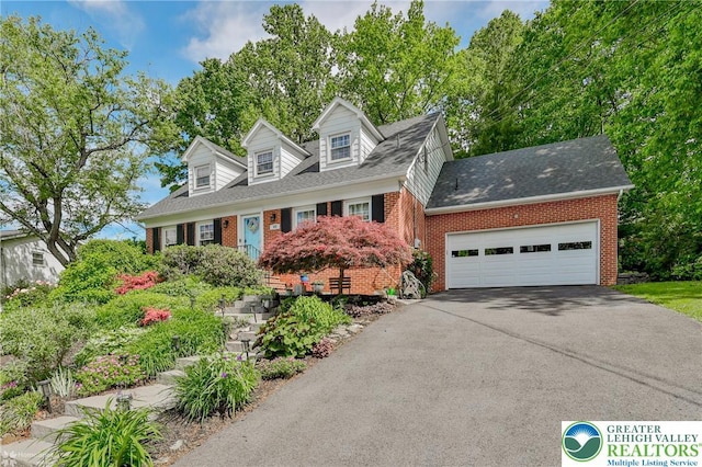 113 S Fairview St, Macungie Borough, PA 18062 - cape cod home with brick siding, driveway, a garage, and roof with shingles