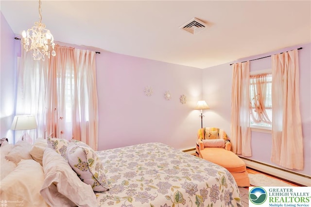 113 S Fairview St, Macungie Borough, PA 18062 - bedroom with baseboard heating, multiple windows, and a chandelier