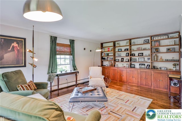 113 S Fairview St, Macungie Borough, PA 18062 - living room featuring a baseboard heating unit and wood finished floors