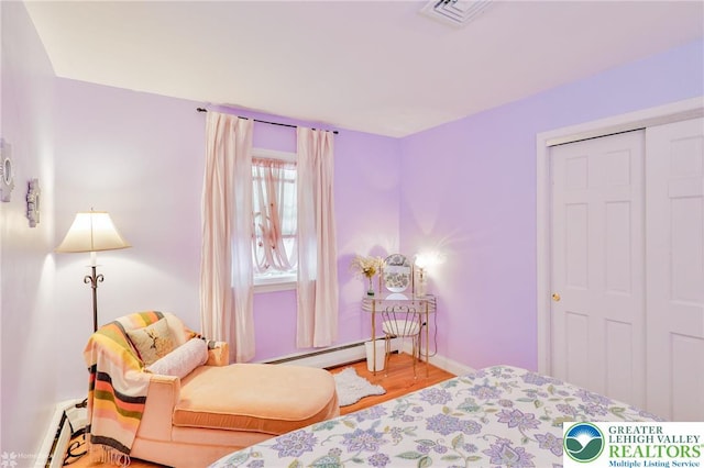113 S Fairview St, Macungie Borough, PA 18062 - bedroom featuring a baseboard radiator, a baseboard heating unit, wood finished floors, baseboards, and a closet