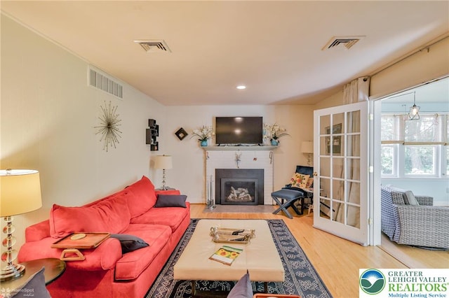 113 S Fairview St, Macungie Borough, PA 18062 - living area featuring wood finished floors and a fireplace with flush hearth