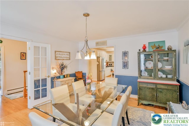 113 S Fairview St, Macungie Borough, PA 18062 - dining area with baseboard heating, light wood-style flooring, and crown molding