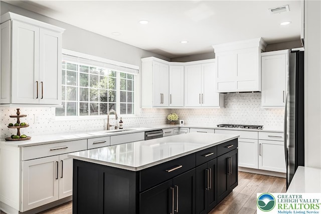 2638 Hollow View Dr, Forks Twp, PA 18040 - kitchen featuring a sink, dark cabinetry, white cabinetry, and recessed lighting