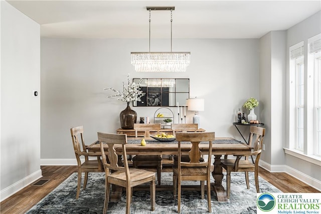 2638 Hollow View Dr, Forks Twp, PA 18040 - dining room with a chandelier, wood finished floors, and baseboards