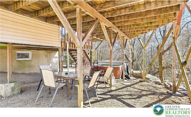 177 Dogwood Ter, Tunkhannock Township, PA 18210 - view of patio with a hot tub, outdoor dining area, and stairway