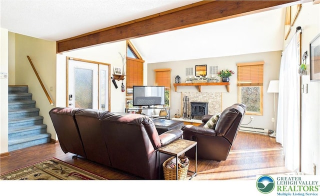 177 Dogwood Ter, Tunkhannock Township, PA 18210 - living room with stairs, wood finished floors, baseboard heating, and a tile fireplace