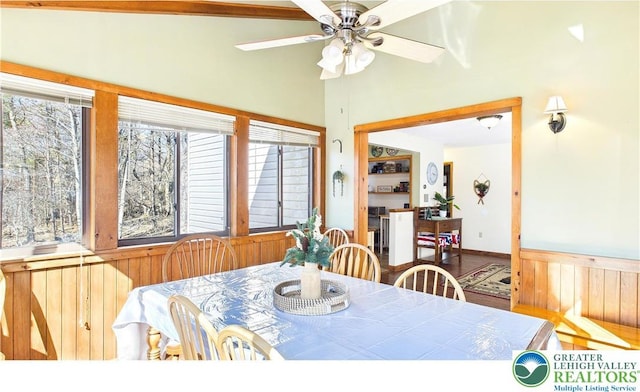 177 Dogwood Ter, Tunkhannock Township, PA 18210 - dining room with a ceiling fan, wood finished floors, and wooden walls