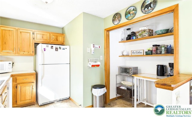 177 Dogwood Ter, Tunkhannock Township, PA 18210 - kitchen featuring white appliances, open shelves, and tile countertops