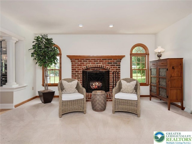 3840 E View Dr, North Whitehall Twp, PA 18069 - living area featuring ornate columns, carpet flooring, baseboards, and plenty of natural light