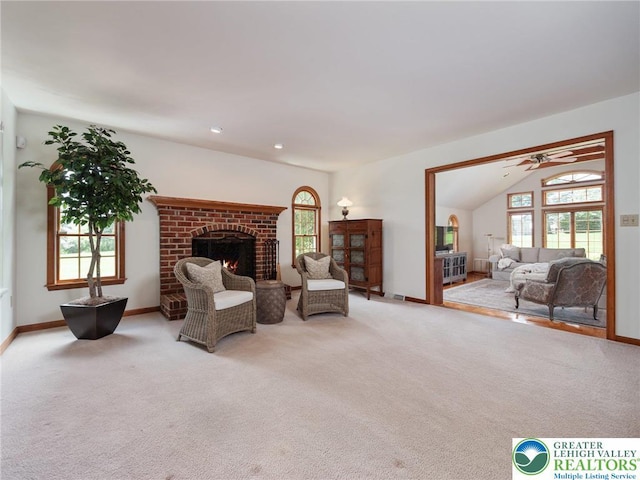 3840 E View Dr, North Whitehall Twp, PA 18069 - carpeted living area featuring a fireplace, baseboards, ceiling fan, and vaulted ceiling