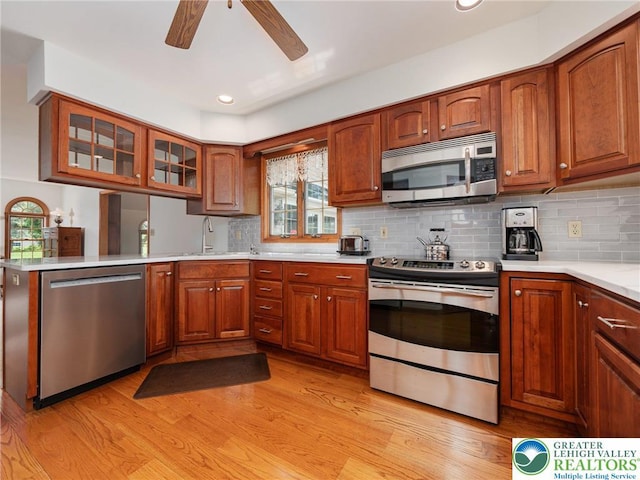 3840 E View Dr, North Whitehall Twp, PA 18069 - kitchen featuring appliances with stainless steel finishes, light wood-style floors, ceiling fan, light countertops, and a sink