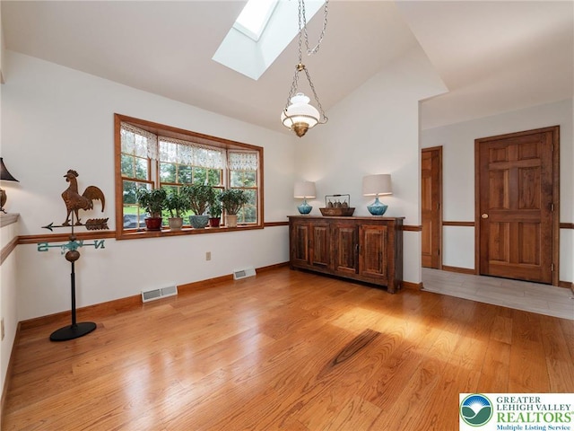 3840 E View Dr, North Whitehall Twp, PA 18069 - entryway featuring a skylight, lofted ceiling, light wood-style flooring, and baseboards
