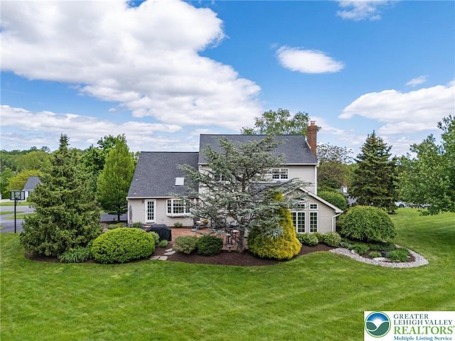 3840 E View Dr, North Whitehall Twp, PA 18069 - back of house with a lawn, a patio area, and a chimney