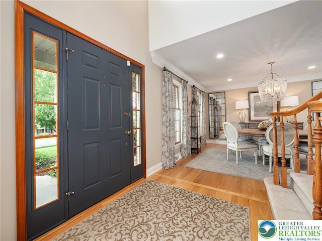 3840 E View Dr, North Whitehall Twp, PA 18069 - foyer featuring light wood-type flooring, a chandelier, baseboards, ornamental molding, and recessed lighting