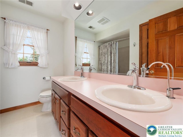 3840 E View Dr, North Whitehall Twp, PA 18069 - bathroom featuring double vanity, baseboards, toilet, a shower with shower curtain, and recessed lighting
