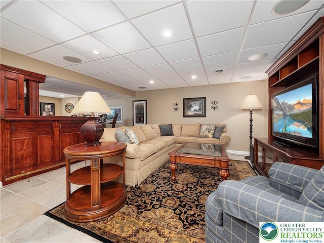3840 E View Dr, North Whitehall Twp, PA 18069 - living room featuring a drop ceiling, recessed lighting, bar, baseboards, and light tile patterned floors