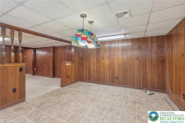 1450 Springhouse Rd, South Whitehall Twp, PA 18104 - empty room featuring a drop ceiling, wood walls, and baseboards