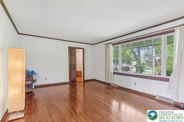 1450 Springhouse Rd, South Whitehall Twp, PA 18104 - empty room with ornamental molding, wood finished floors, and baseboards