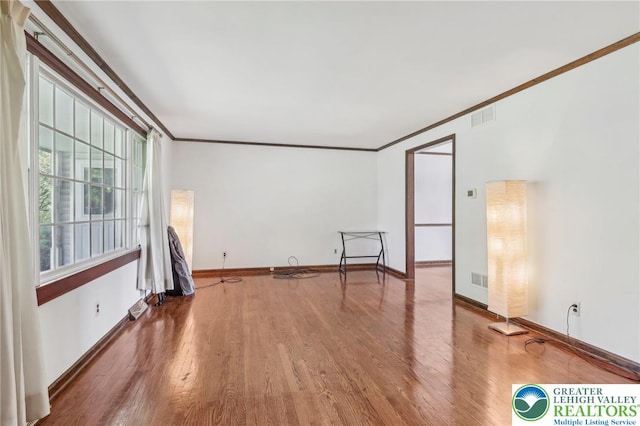 1450 Springhouse Rd, South Whitehall Twp, PA 18104 - empty room featuring crown molding, wood finished floors, and baseboards