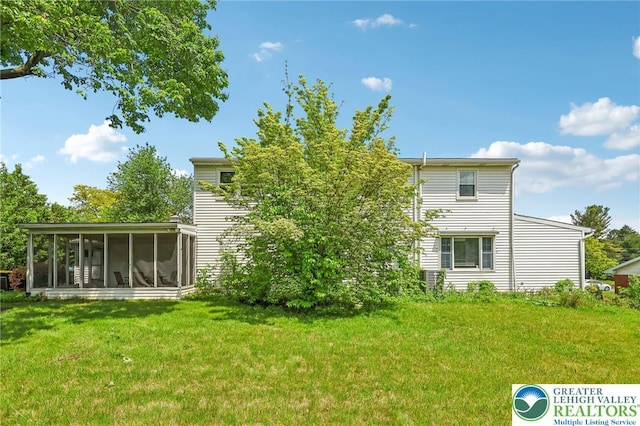 1450 Springhouse Rd, South Whitehall Twp, PA 18104 - back of house featuring a sunroom and a lawn