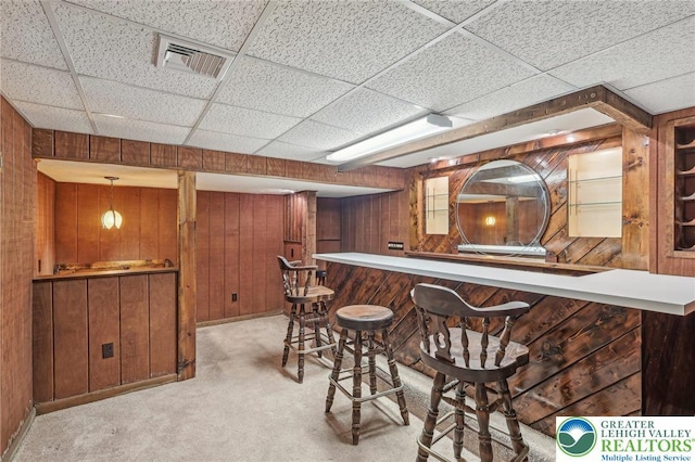 1450 Springhouse Rd, South Whitehall Twp, PA 18104 - indoor dry bar featuring wood walls, light carpet, and a drop ceiling