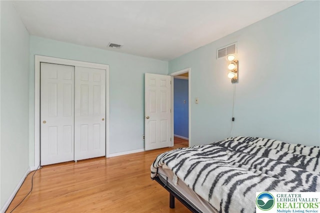 1450 Springhouse Rd, South Whitehall Twp, PA 18104 - bedroom featuring a closet, light wood-style flooring, and baseboards