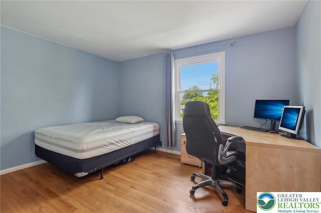 1450 Springhouse Rd, South Whitehall Twp, PA 18104 - bedroom with wood finished floors, an office area, and baseboards