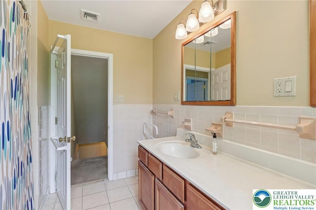 1450 Springhouse Rd, South Whitehall Twp, PA 18104 - bathroom with vanity, tile patterned flooring, a wainscoted wall, and tile walls