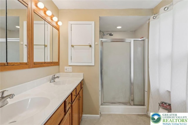 1450 Springhouse Rd, South Whitehall Twp, PA 18104 - full bathroom featuring a shower stall, double vanity, baseboards, and tile patterned flooring