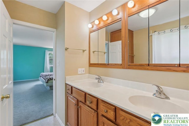 1450 Springhouse Rd, South Whitehall Twp, PA 18104 - ensuite bathroom featuring double vanity and baseboards
