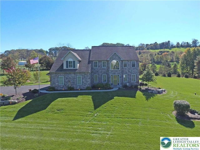 4408 Irish Creek Rd, Pa, PA 19506 - colonial-style house with a front yard and stone siding