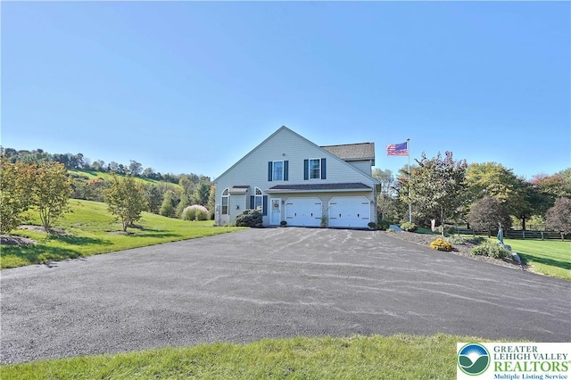 4408 Irish Creek Rd, Pa, PA 19506 - view of front of property with a garage, asphalt driveway, and a front yard