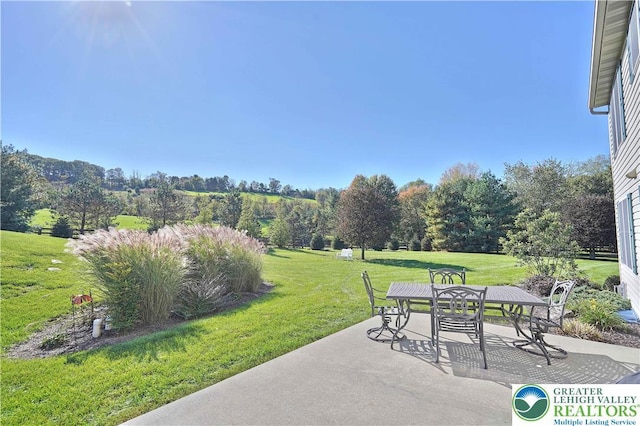 4408 Irish Creek Rd, Pa, PA 19506 - view of patio / terrace with outdoor dining space and view of scattered trees