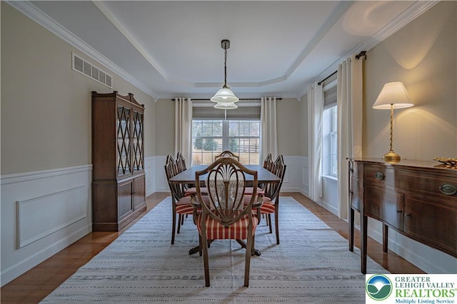 4408 Irish Creek Rd, Pa, PA 19506 - dining room with a tray ceiling, wainscoting, wood finished floors, and a decorative wall